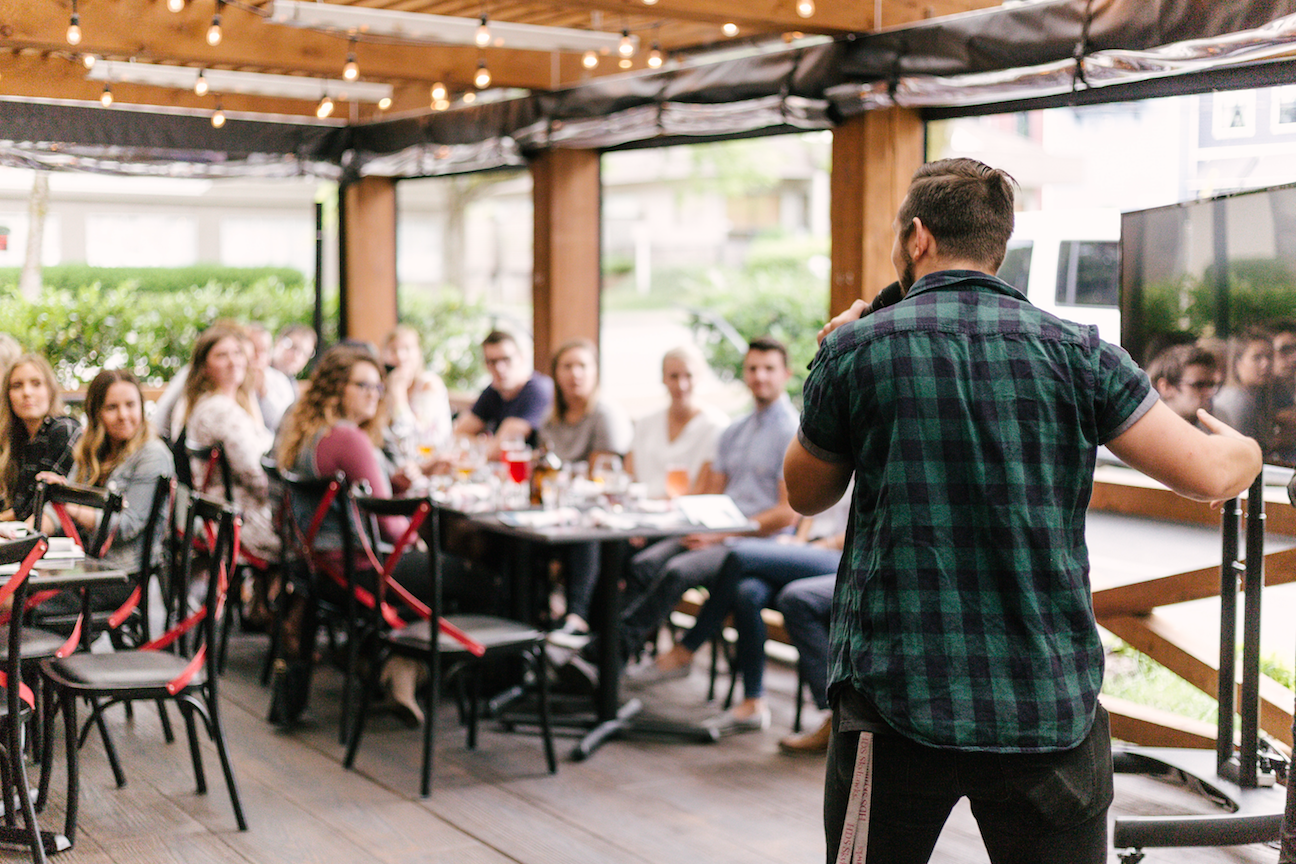 How to Turn Customer into Brand Advocates Man speaking to crowd