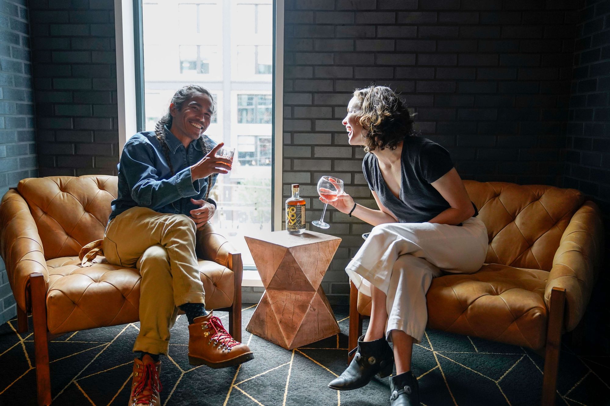 how a birthday sparked an idea for a zero-alcohol brand - photo of a man and woman enjoying a non-alcoholic whiskey drink 