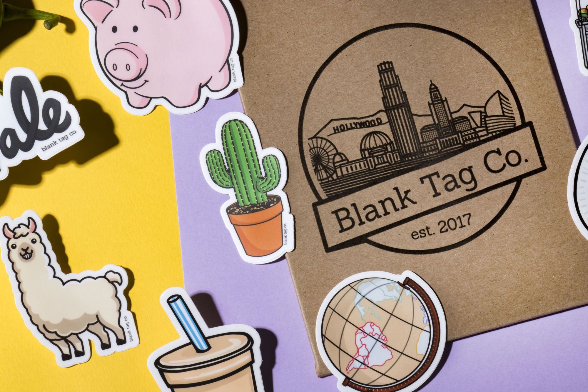15 latino and latina-owned businesses to support during hispanic heritage month blog photo of blank tag co. stickers and logo