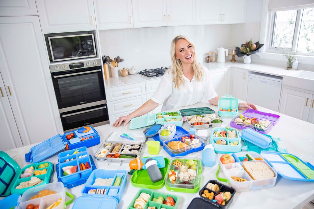 Tracey from adventure snacks in the kitchen with lunchbox products 