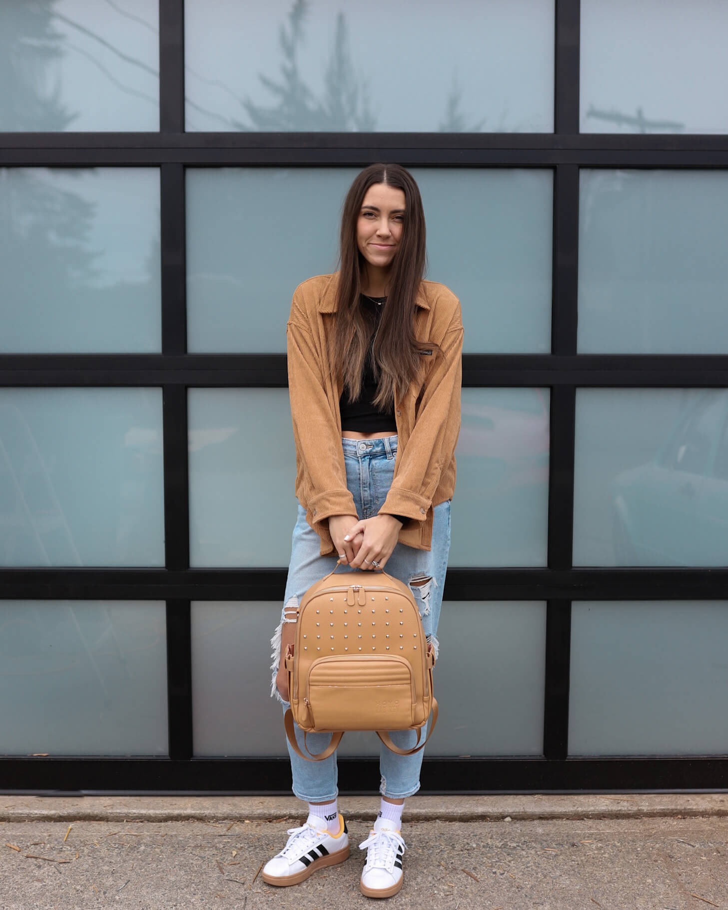 Mallory showing a Rad Rev bag outside