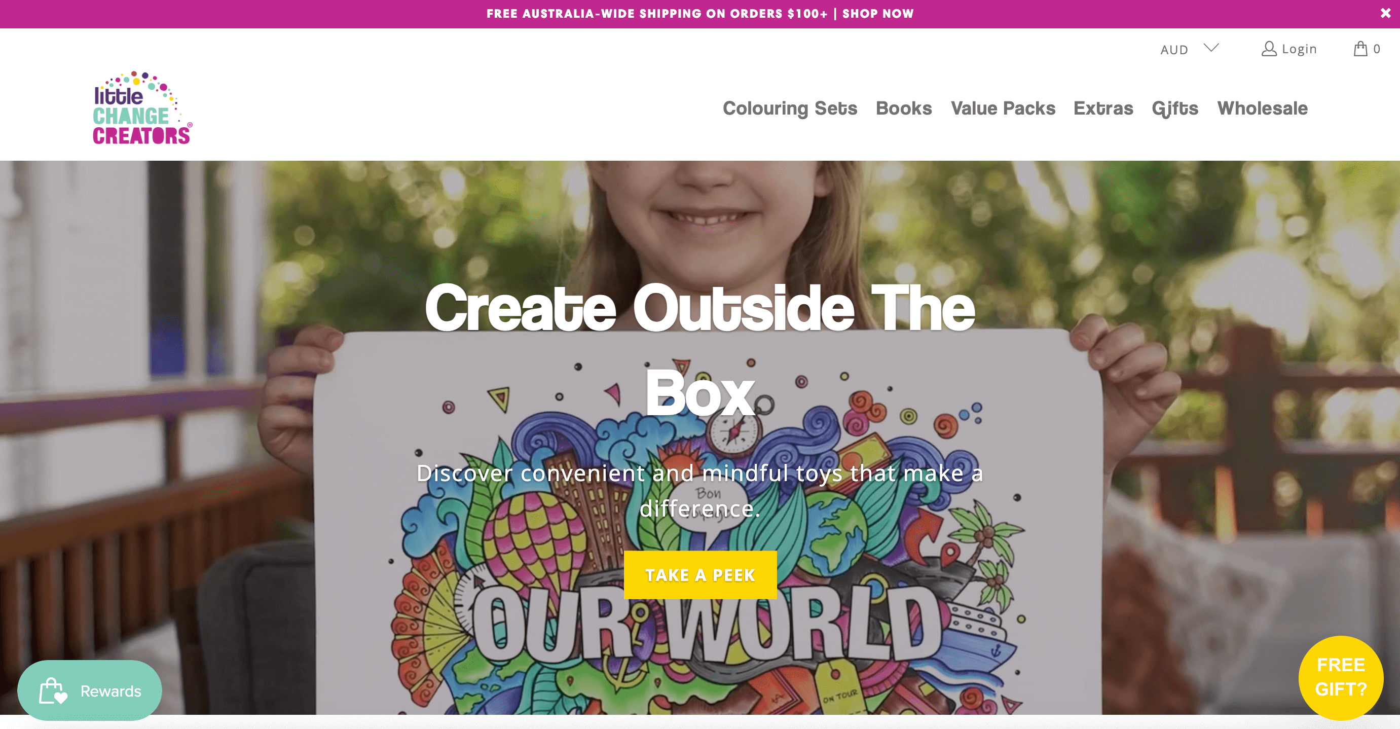 Sustainable brands–Little Change Creators website homepage. The banner image shows a smiling child holding a colorful drawing with the words Our World surrounded by images of globes, leads, trees, and other icons. The text on top of the image says Create Outside The Box. Discover convenient and mindful toys that make a difference. Take a Peek. 