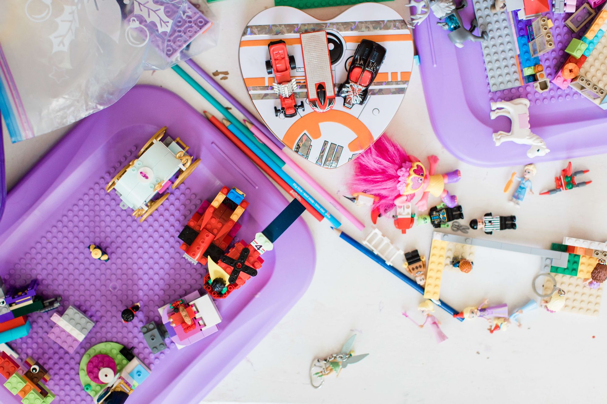 overlay photo of purple and different colored LEGOS on a childrens desk