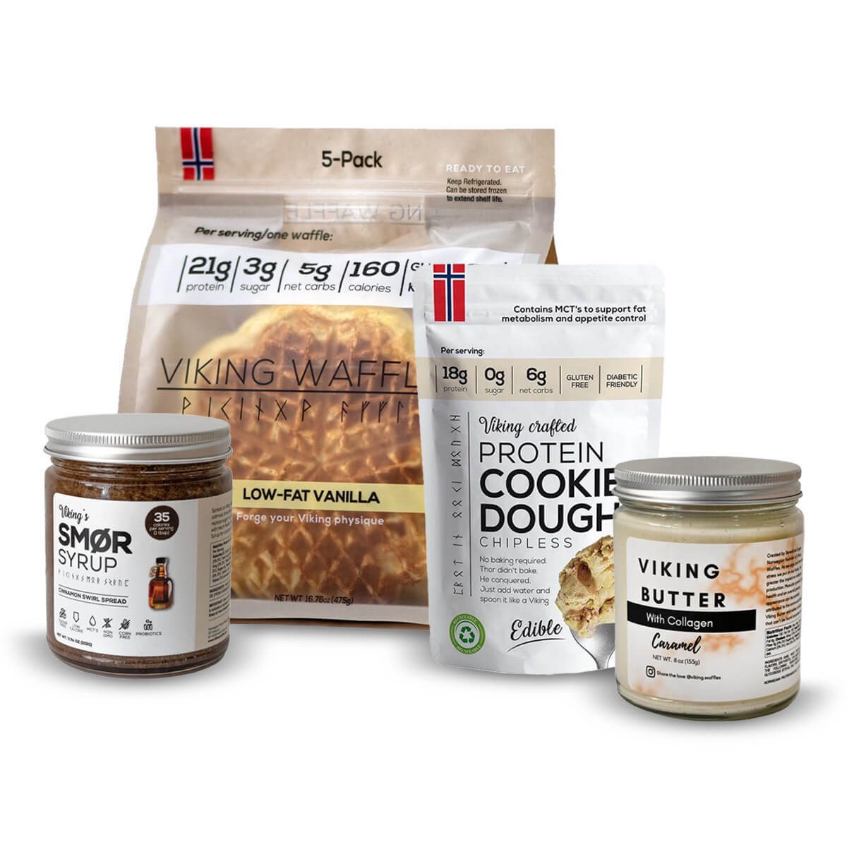 Product shot showing 4 Viking Waffles products.  From left to right: a jar of Smør syrup, a bag of low-fat vanilla wafers, protein cookie dough, and a jar of caramel viking butter with collagen.  All products have brand labels and clearly highlight nutritional information such as protein, sugar, carbohydrates and calories in bold. 