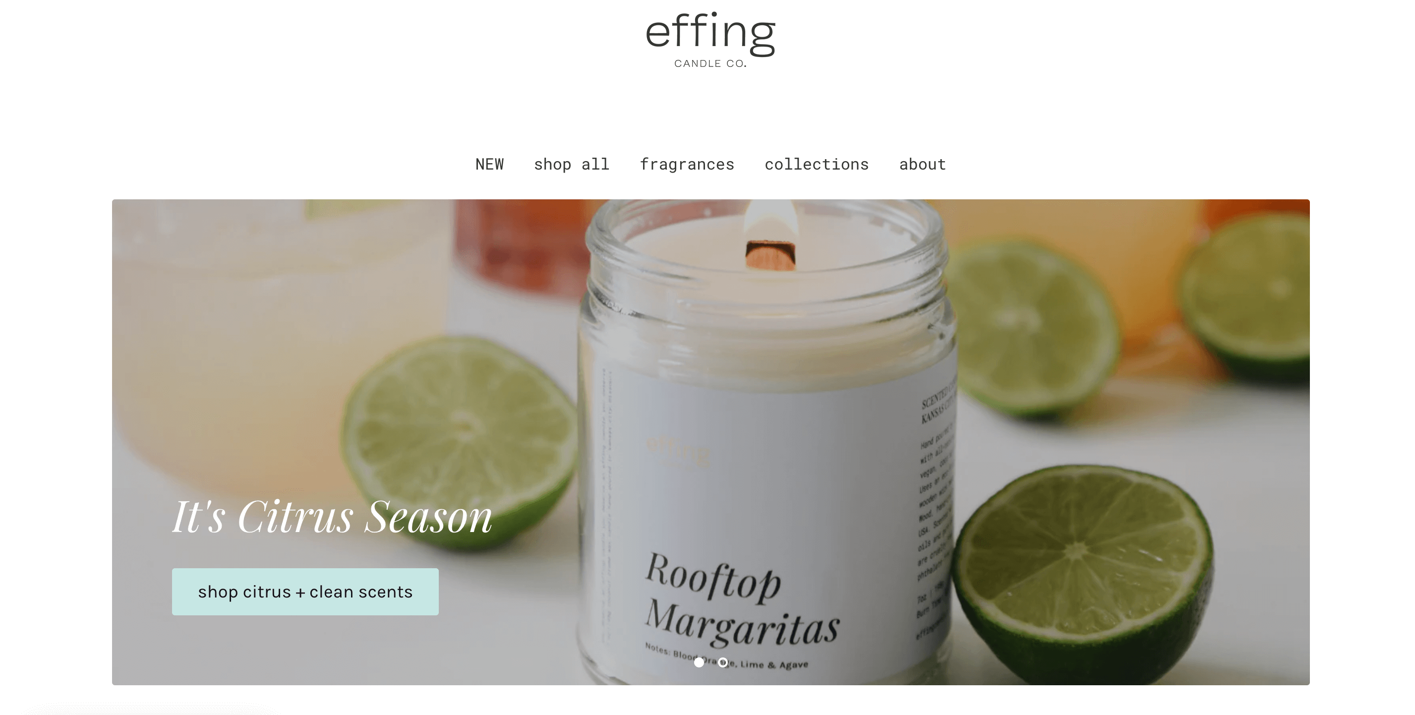 A screenshot from Effing Candle Co.’s homepage of its website. It shows the brand logo, main website menu, and a banner image. The image shows a burning, wood wick candle, with a white, minimalist label that says Rooftop Margaritas. There are several limes surrounding the candle.  There is text beside the candle: It’s Citrus Season. Shop citrus and clean scents. 