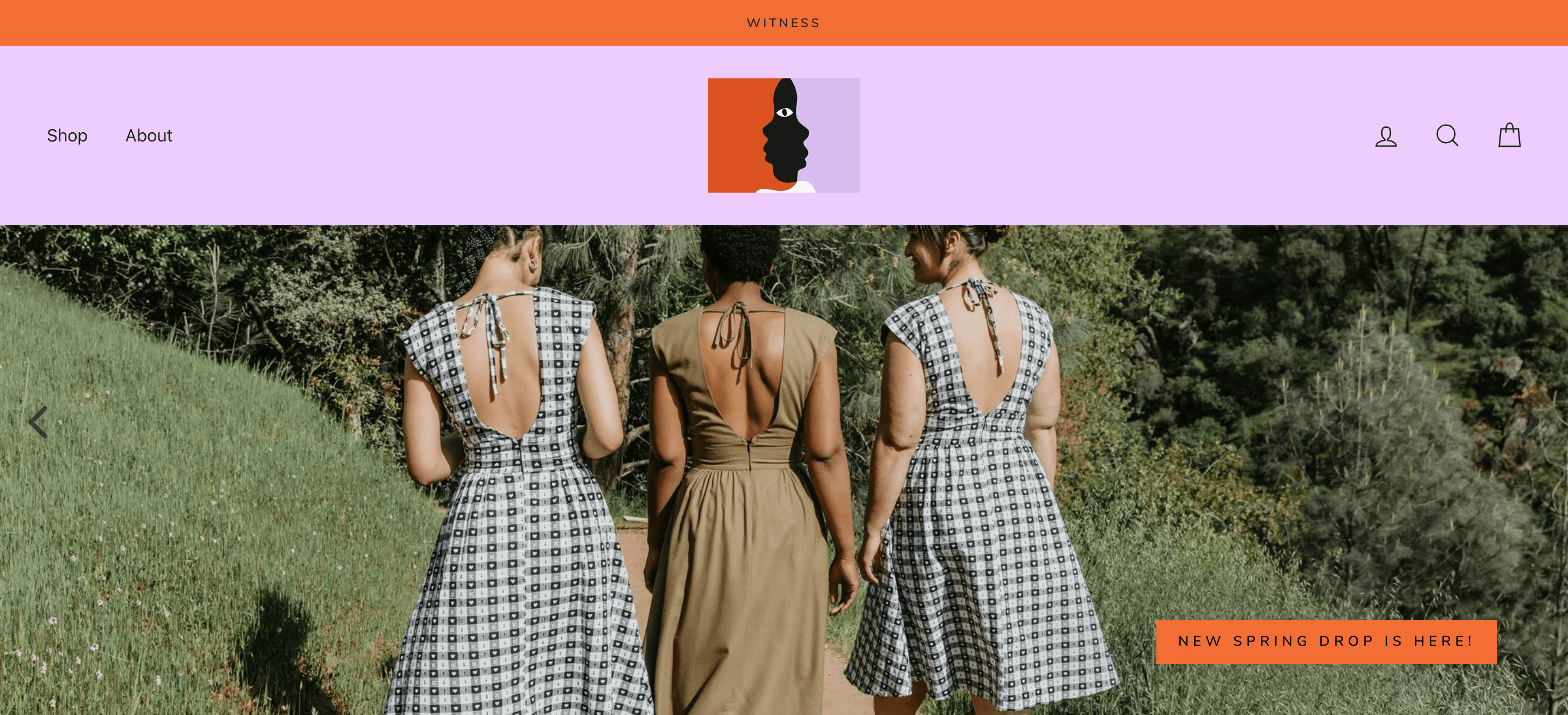 An image of Witness Oakland’s homepage. The banner image shows three women walking on a path surrounded by grass and trees. Two of the women are wearing black and white patterned dresses and the woman in the middle is wearing a brown dress in the same style. The call-to-action says: New Spring Drop is Here!