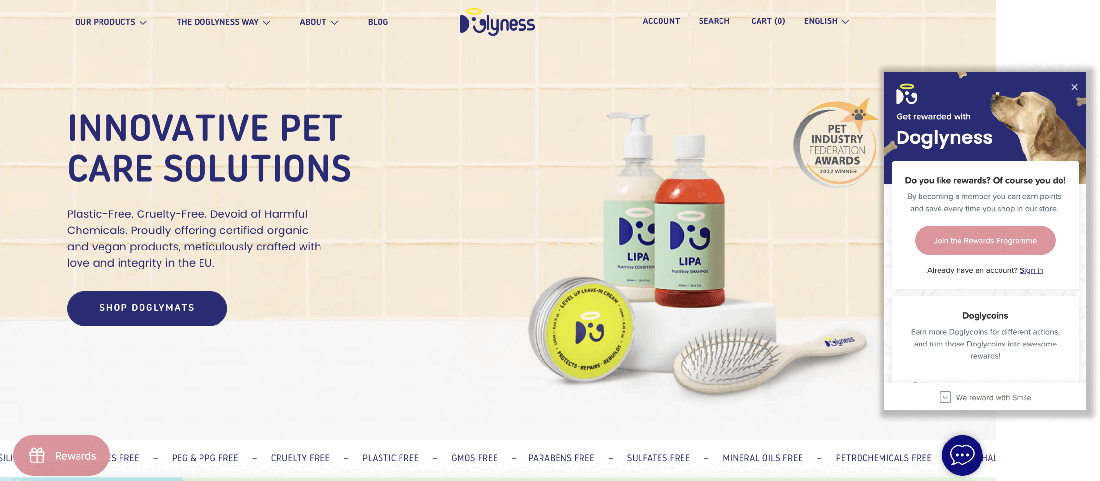 A screenshot from Dogylness’ homepage showing images of its products. There is also a screenshot of its rewards program panel where customers can earn Doglycoins. 
