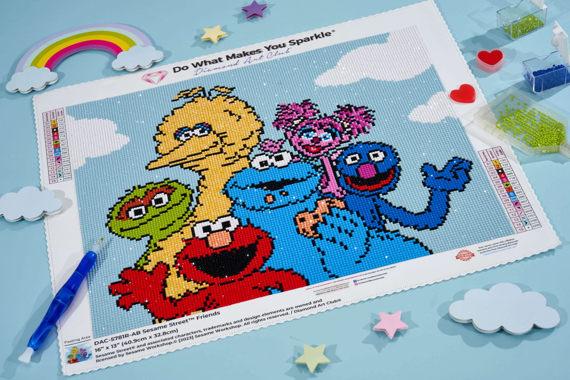 A photo of a Sesame Street diamond art kit showing Elmo, Big Bird, Cookie Monster, Oscar, Abby Cadabby, and Grover. 