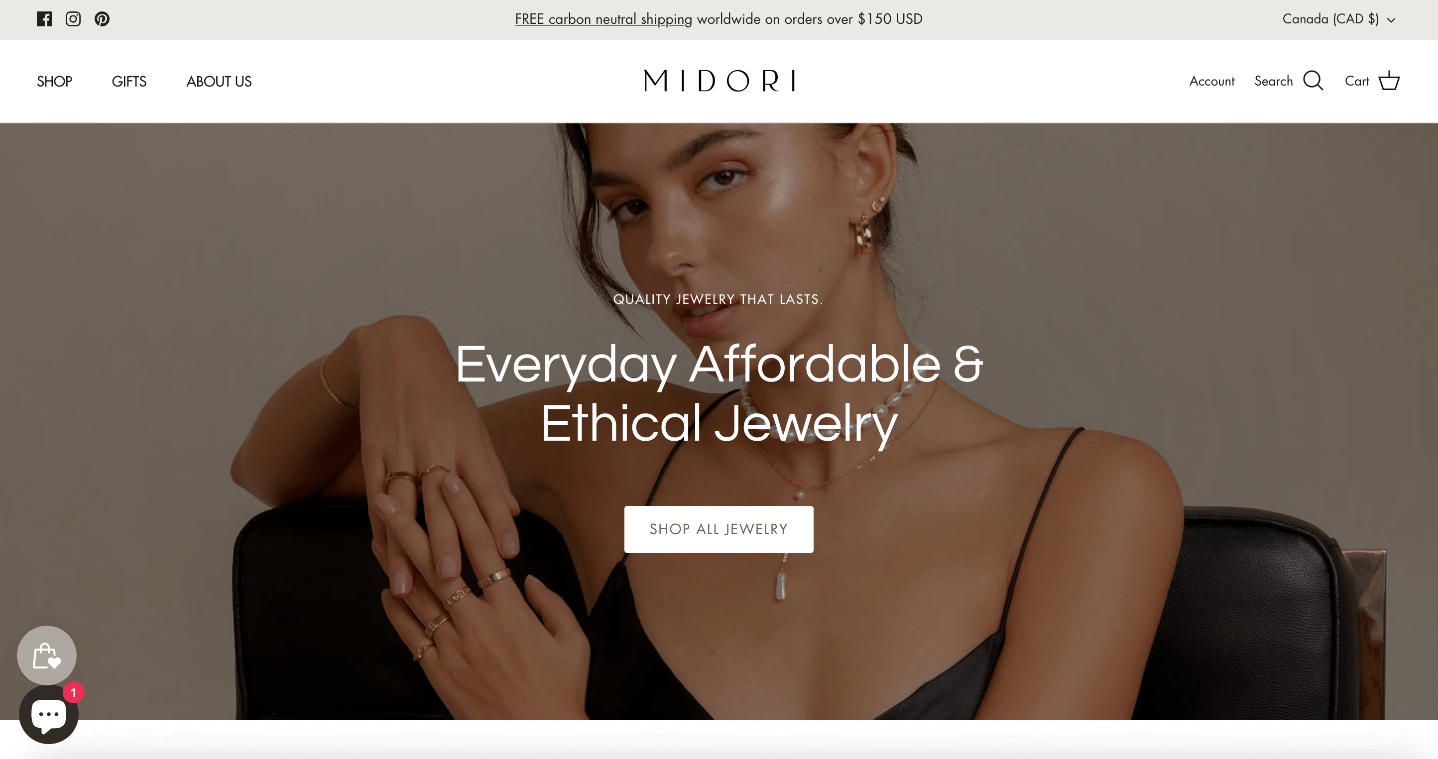 Valentine’s Day Gift Guide–A screenshot from Midori Jewelry Co.’s homepage showing a woman wearing several dainty gold jewelry pieces. 