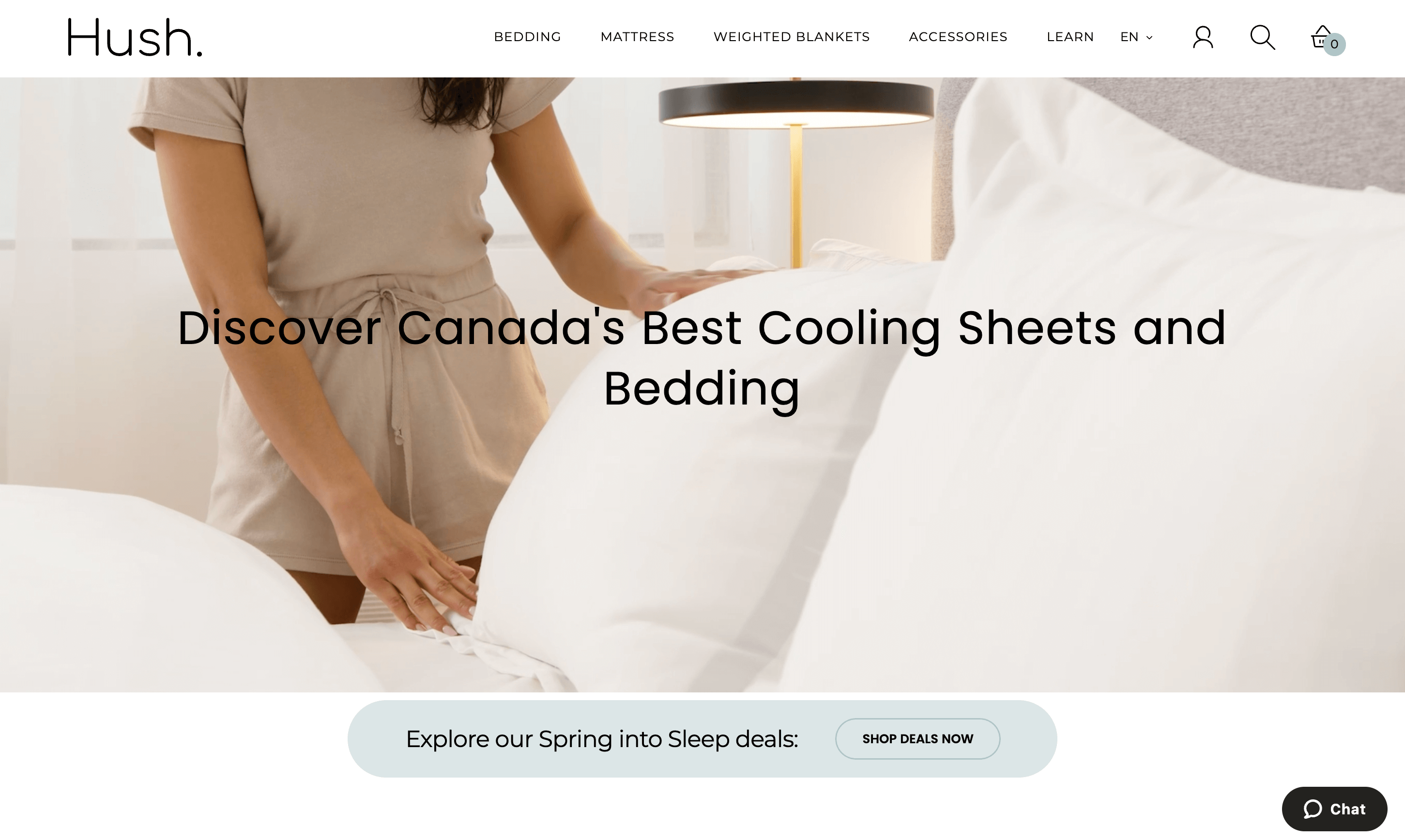 A screenshot of Hush’s homepage showing an image of someone making the bed with their cooling sheets. 